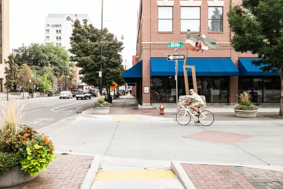 A man on a bike prepares to turn off a one way street onto a bike lane in Downtown Boise, Idaho.